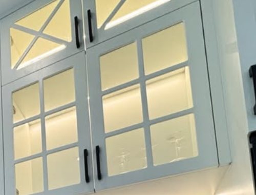 Lit glazed cabinet doors with cross mullions