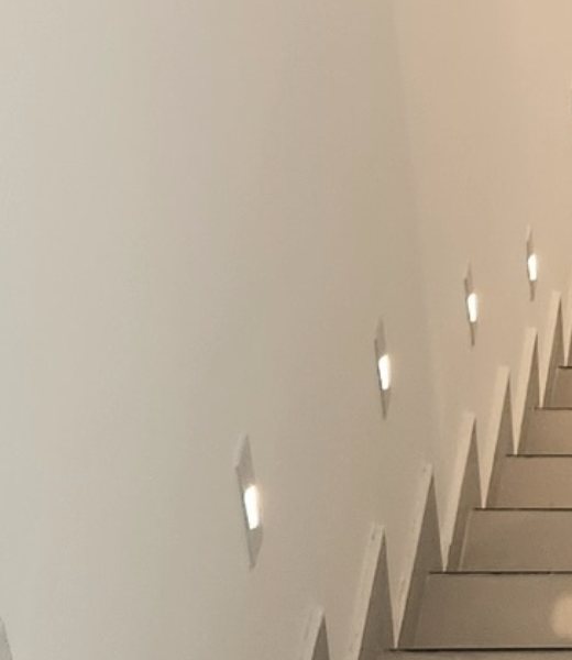 Recessed wall lights along a staircase